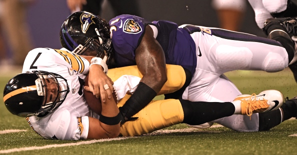 Ben Roethlisberger is crushed by the Ravens' Courtney Upshaw Thursday in Baltimore. -- GETTY IMAGES