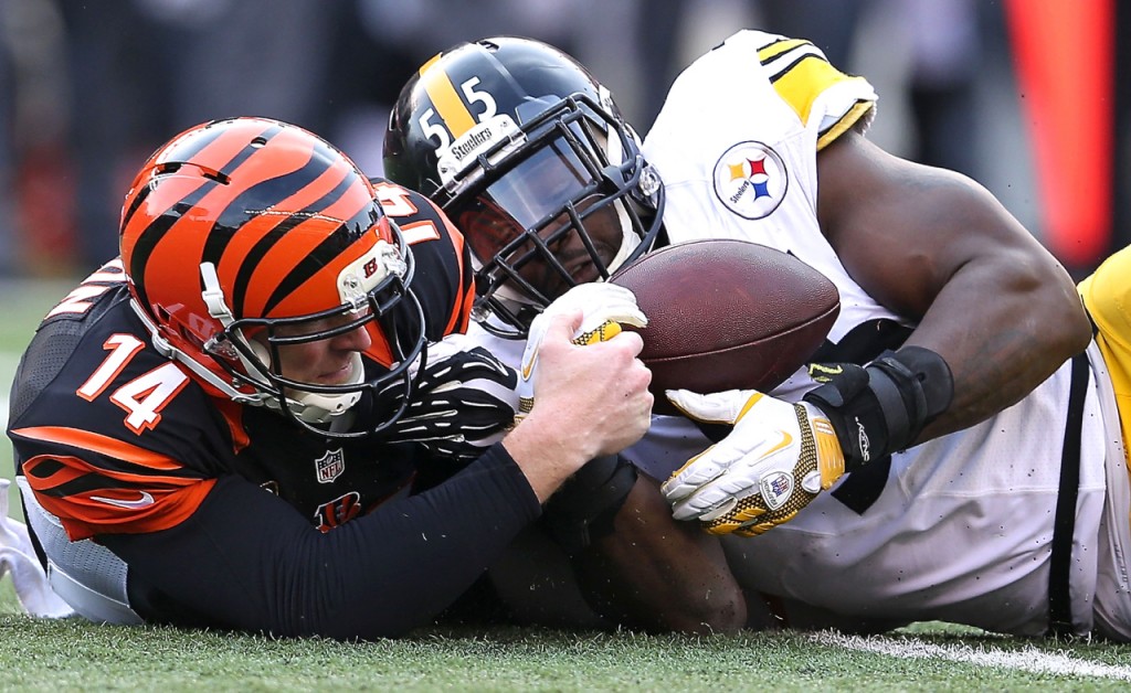 Andy Dalton's fourth-quarter fumble Sunday was recovered by Arthur Moats. -- GETTY