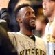 MILWAUKEE, WI - SEPTEMBER 21:  Andrew McCutchen #22 of the Pittsburgh Pirates celebrates with teammates after a  first inning home run against the Milwaukee Brewers at Miller Park on September 21, 2016 in Milwaukee, Wisconsin.  (Photo by Stacy Revere/Getty Images)