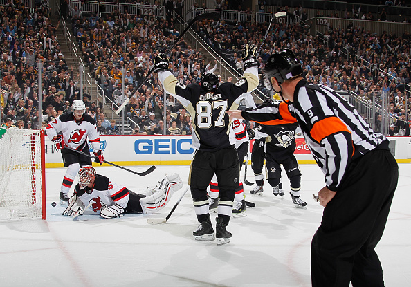 Sidney Crosby celebrates his first of two goals, a redirect set up by Simon Despres. -- GETTY IMAGES