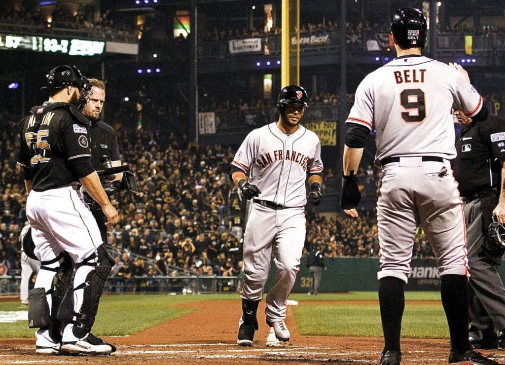 Brandon Crawford crosses home after his fourth-inning grand slam Wednesday at PNC Park. -- GETTY IMAGES
