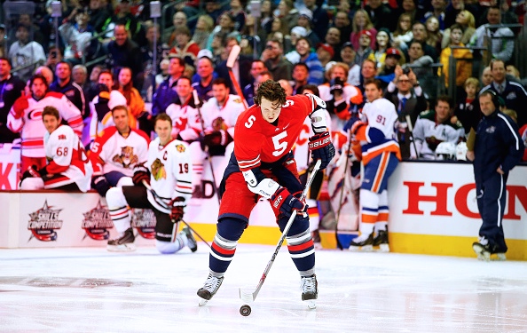 Ryan Johansen strips off his Blue Jackets sweater to pay homage to national champion Ohio State. -- GETTY